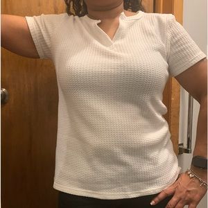 White waffle knit short sleeve low-cut split neck top. Size L.